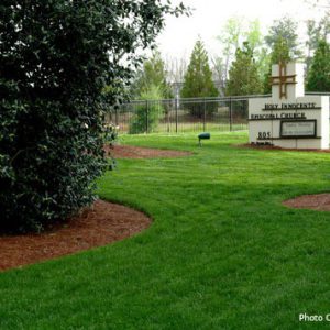 green grass and church sign