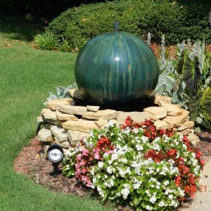 green fountain on stones