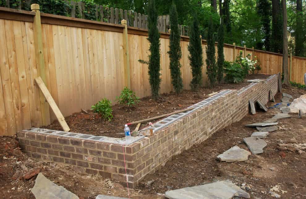 Retaining wall and raised plant bed in Brookhaven Georgia by Personal Touch Lawn Care