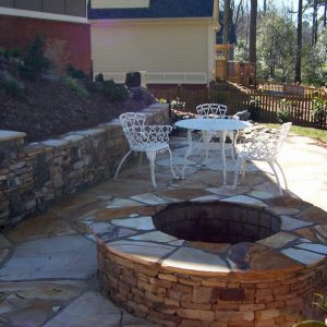 firepit and table and chairs in backyard