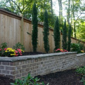 flower bed and brick wall