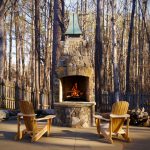 outdoor fireplace with chairs