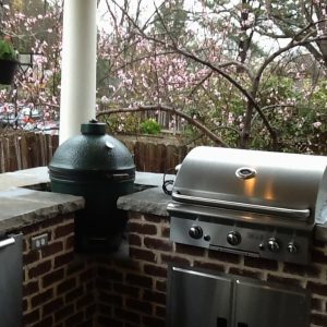 outdoor grill with stone wall