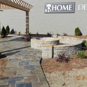 firepit with stone wall and pergola