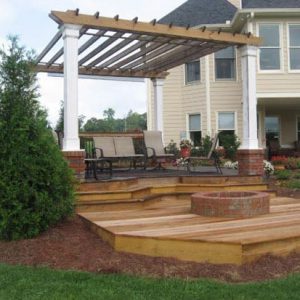 firepit and pergola in backyard